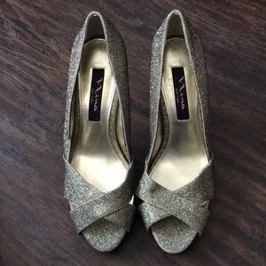 Nina New York Gold Sparkle Pumps.